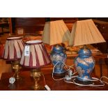 A pair of gilt ormolu type table lamps with shades, 30cm high,