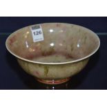 A Chinese porcelain bowl, decorated with red inclusions on a mottled grey ground,