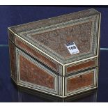 An Indian type carved wood and bone inlaid stationary box, the hinged lid enclosing fitted interior,
