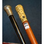 An ivory handled walking stick circa early 20th century, the handle with foliate decoration,