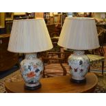 A pair of Chinese type ceramic vase lamps with shades,