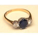 An 18ct gold and platinum sapphire and diamond ring,