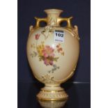A Royal Worcester blush ivory porcelain vase, decorated with hand painted floral panels and gilding,