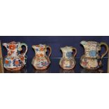 Four Masons pottery jugs circa 19th century, decorated with floral panels on white ground,