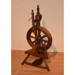 A spinning wheel circa early 20th century,