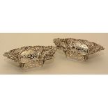 A pair of silver bon-bon dishes, hallmarks for Birmingham 1908, with embossed foliate decoration,