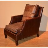 A leather armchair by George Smith, in wine colour,