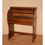 A pine bureau/desk, with tambour shutter above two drawers, 107cm high x 89cm wide x 47.