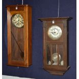 An oak wall clock circa 1930's/40's, with silvered dial and pendulum, 75cm high,