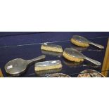 A silver backed dressing table brush set, hallmarks for Birmingham,