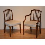 A set of eight Georgian style mahogany dining chairs, including two carvers, with bar backs,
