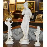 A large resin female statuette in the classical style, 70 cm high,