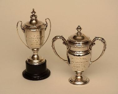 Two small silver prize cups, hallmarks for Birmingham 1913, and Chester 1938, 13cm & 15cm high,