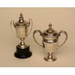 Two small silver prize cups, hallmarks for Birmingham 1913, and Chester 1938, 13cm & 15cm high,