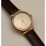 A Jaeger Le Coultre gents wristwatch, the champagne dial with Arabic and baton numerals,