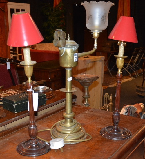 A pair of Victorian mahogany candlesticks, the reeded stem on circular base,
