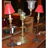A pair of Victorian mahogany candlesticks, the reeded stem on circular base,