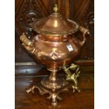 An Arts and Crafts copper samovar, with brass tap, manufactured by Warner & Sons, London,