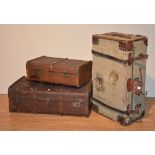 Three vintage travel trunks, with hinged tops,