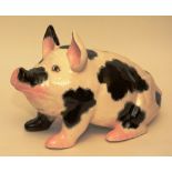 A Wemyss coin bank by Griselda Hill Pottery, modelled as a pig,