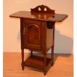 A late Victorian mahogany bedside locker, with drop leaves above panelled door and undertier,