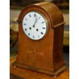 An Edwardian mahogany inlaid bracket clock, the white enamel dial with Roman numerals,