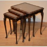 A walnut nest of three tables,