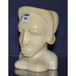 An African carved ivory bust of a female, 18.