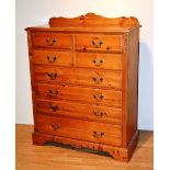 A modern pine chest of drawers, with two pairs of small drawers above four long graduated drawers,