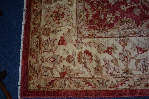 A Persian carpet, the overall cream floral motif over red ground, with cream and red border, - Image 4 of 4