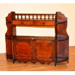 A mahogany hanging wall cupboard, with two drawers above open recess, and two panelled doors,