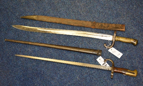Two 19th century French bayonets, with leather and metal scabbard, 52cm x 56. - Image 2 of 2