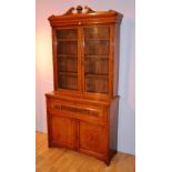 A Victorian oak bookcase on cupboard base,