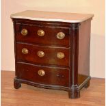 A late 18th/early 19th century mahogany serpentine commode chest with marble top,