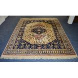 An Eastern style rug, the triple central blue and pink diamonds over cream ground,