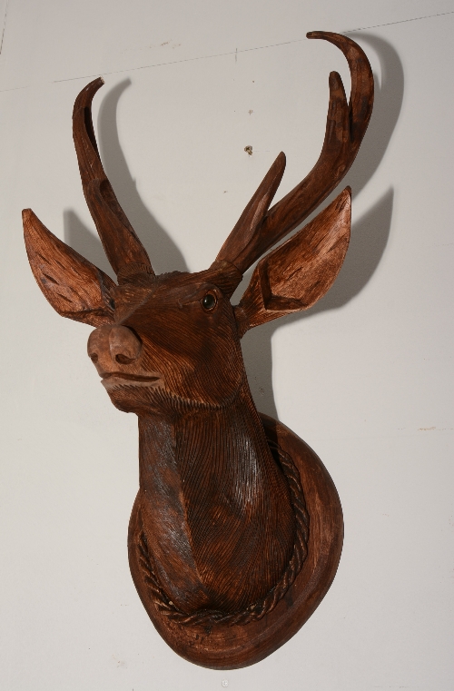 A Black Forest style carved wood stags head, raised on plinth, - Image 2 of 2