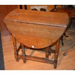 A small oak gateleg table, with drop leaves,