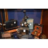A small collection of cameras, film projectors, and telescopes, to include Cine Kodak,