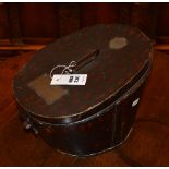 A vintage military tin hat box by F.W. Flight - Military Tailor Winchester, with label to L.J.