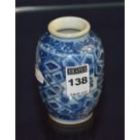 A small Chinese blue and white pottery spill vase, decorated with foliate panels,