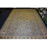 A Keshan carpet, with central foliate medallion over pale blue ground and allover foliate motif,