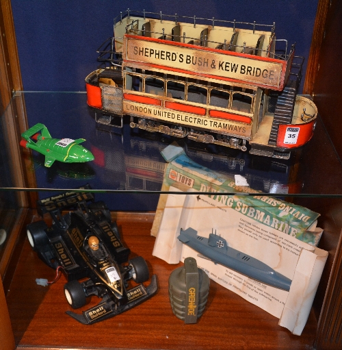 A vintage tin plate model London tram, with open air top,