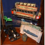 A vintage tin plate model London tram, with open air top,