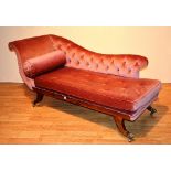 A 19th century rosewood framed chaise longue, upholstered in later pink velour with rolled cushion,