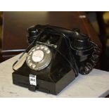 A vintage black Bakelite telephone, circa 1944, GPO 312F to base, converted for modern use,