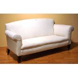 A vintage cream upholstered two seater settee,