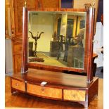 A Regency mahogany and walnut dressing mirror, with three fitted drawers,