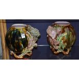 A pair of Alloa majolica pottery vases, with shell relief decoration on purple, green,