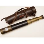 An early 20th century brass three draw telescope by Ross of London, with leather grip and case,