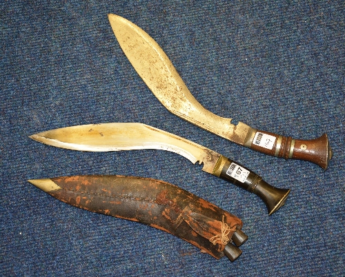 Two vintage Gurkha Kuhkri daggers, one with sheath,